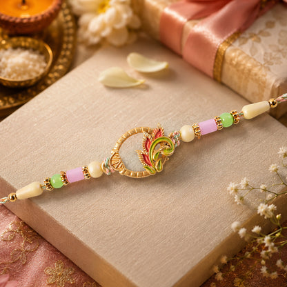 Enamel Peacock Pendant Rakhi with Green and Orange Beads