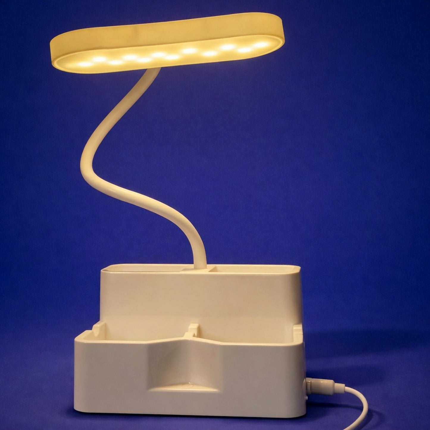 Flexible gooseneck arm of LED desk lamp angled for reading