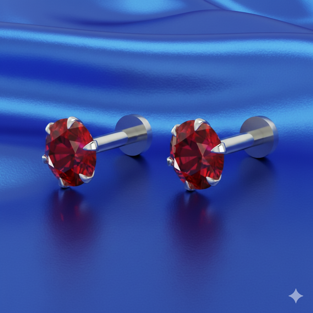 Close-up of a single red ruby nose pin stud with silver plating