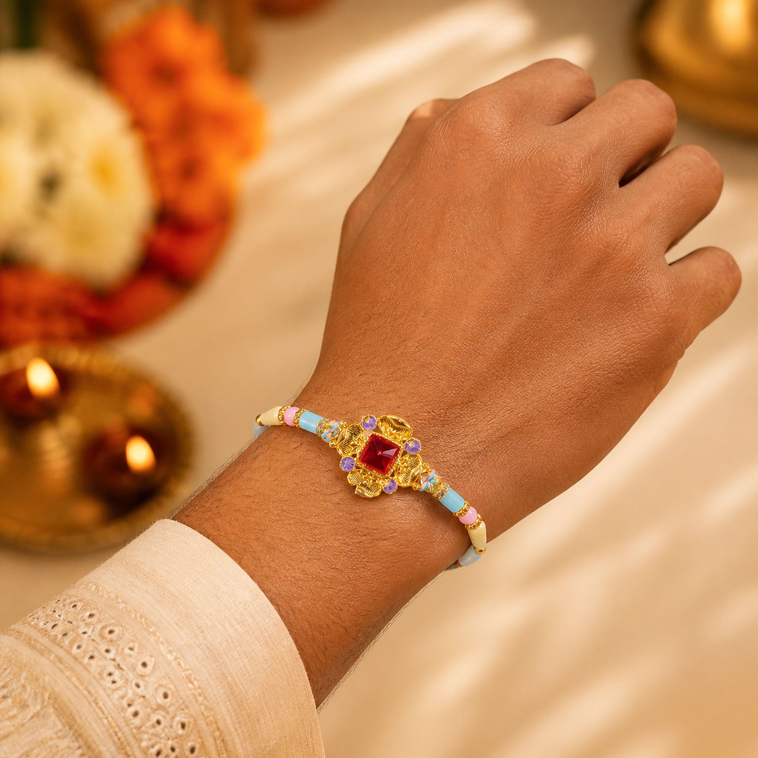 Ornate Rakhi showcasing Square Crystal Charm, gift finish and chain look for Gift Use
