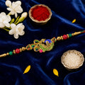 Green and Blue Peacock Enamel Pendant Rakhi with Red and Green Beads