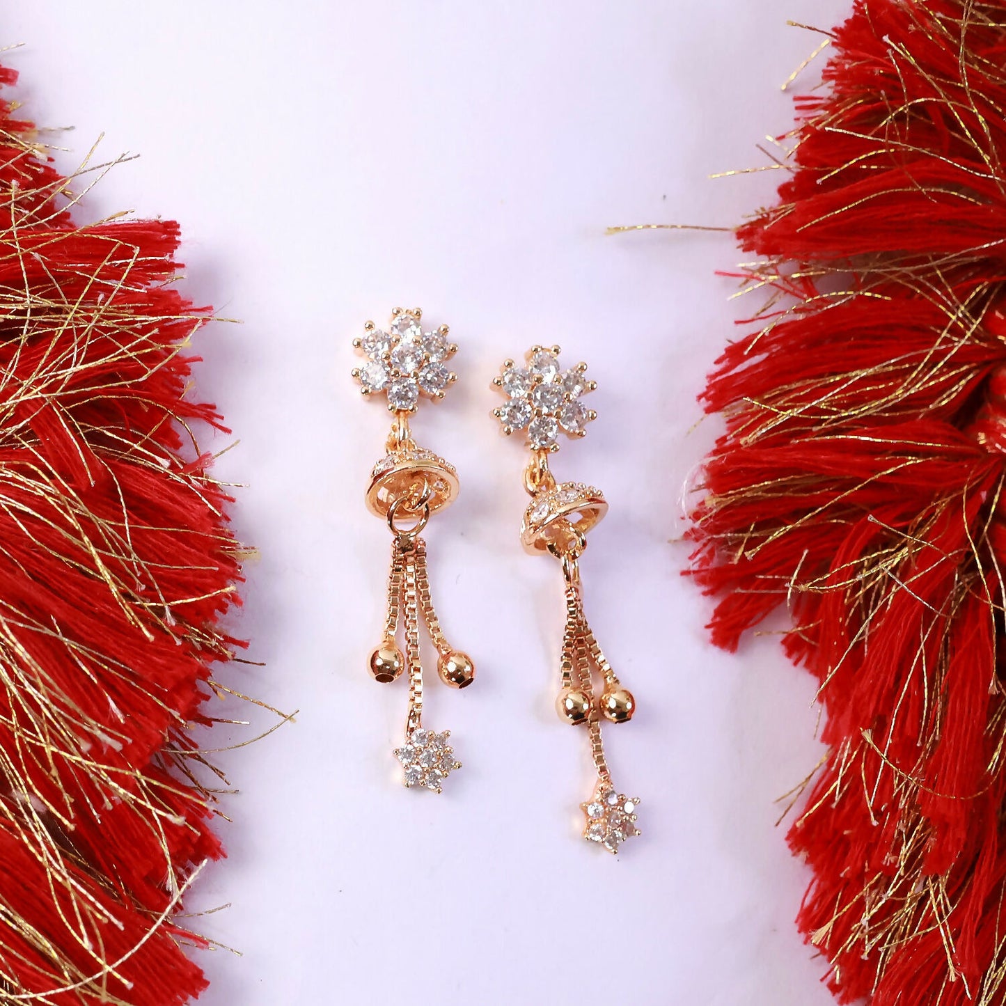 Floral crystal drop earrings with shining floral studs and gold-tone chain tassels
