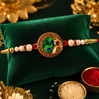 Shop Peacock Feather Rakhi with Pearl Bead Accents Red Thread (5pcs)