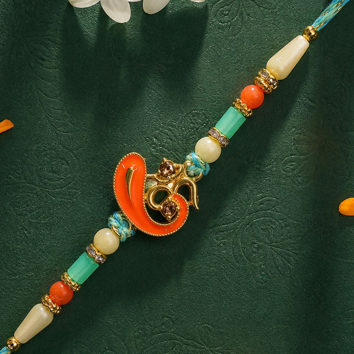 Traditional Rakhi with Om Symbol Charm and leaf detail in thread style for Gift Use