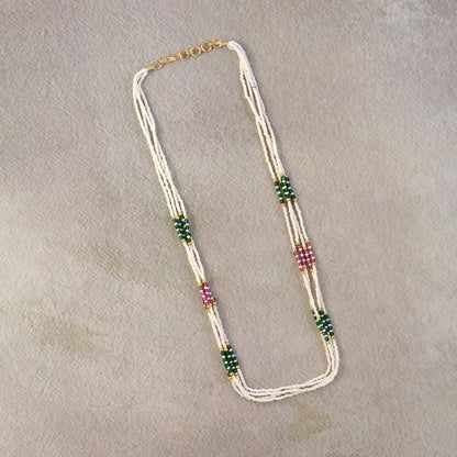 Gold-toned detailing on pearl mala necklace with vibrant beads