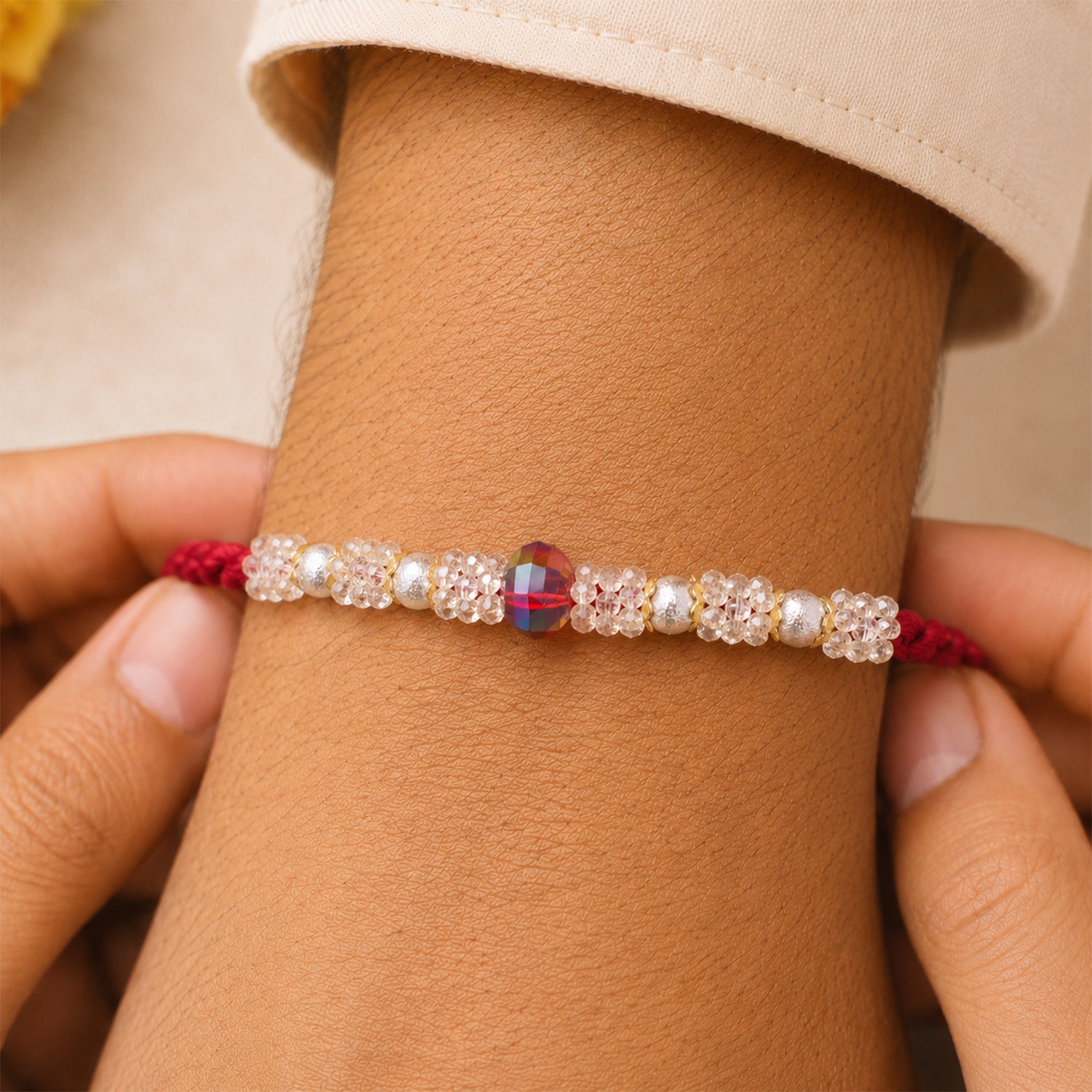Graceful Pastel Bracelet Rakhi with Silver Centre and Delicate Raksha Bandhan Beauty