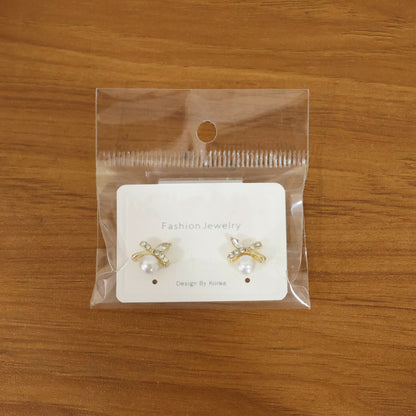 Pearl butterfly stud earrings with a modern fashion setting