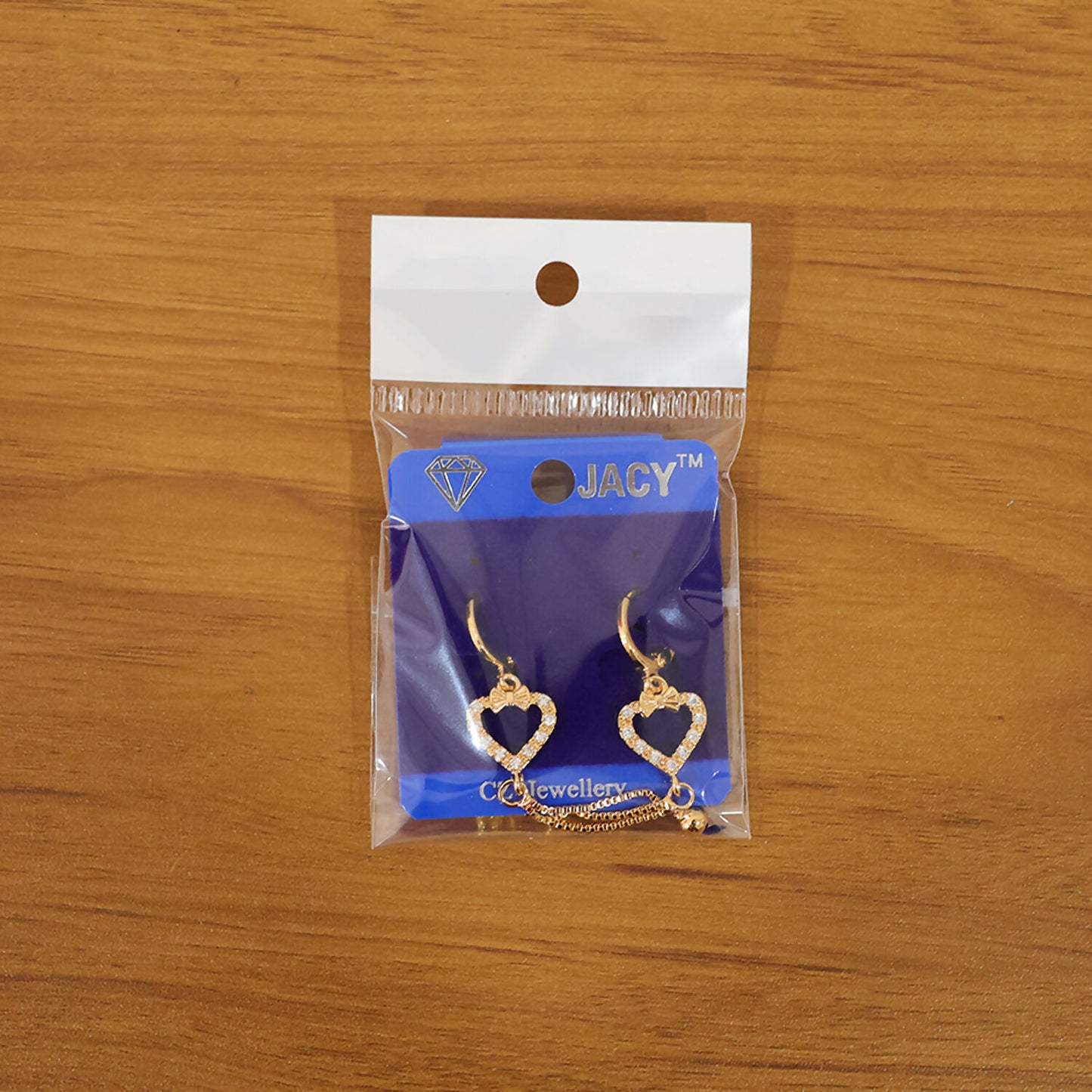 Pair of heart shape drop earrings featuring elegant chain tassels