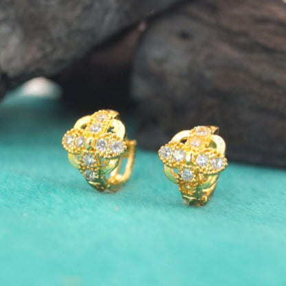 Pair of gold plated floral cluster huggie hoop earrings front view