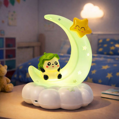 A whimsical green moon night light with a character and star, casting a soft glow in a blue-themed child's room.