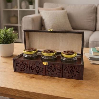 Transparent glass jars inside wooden storage box for dry fruits and mukhwas