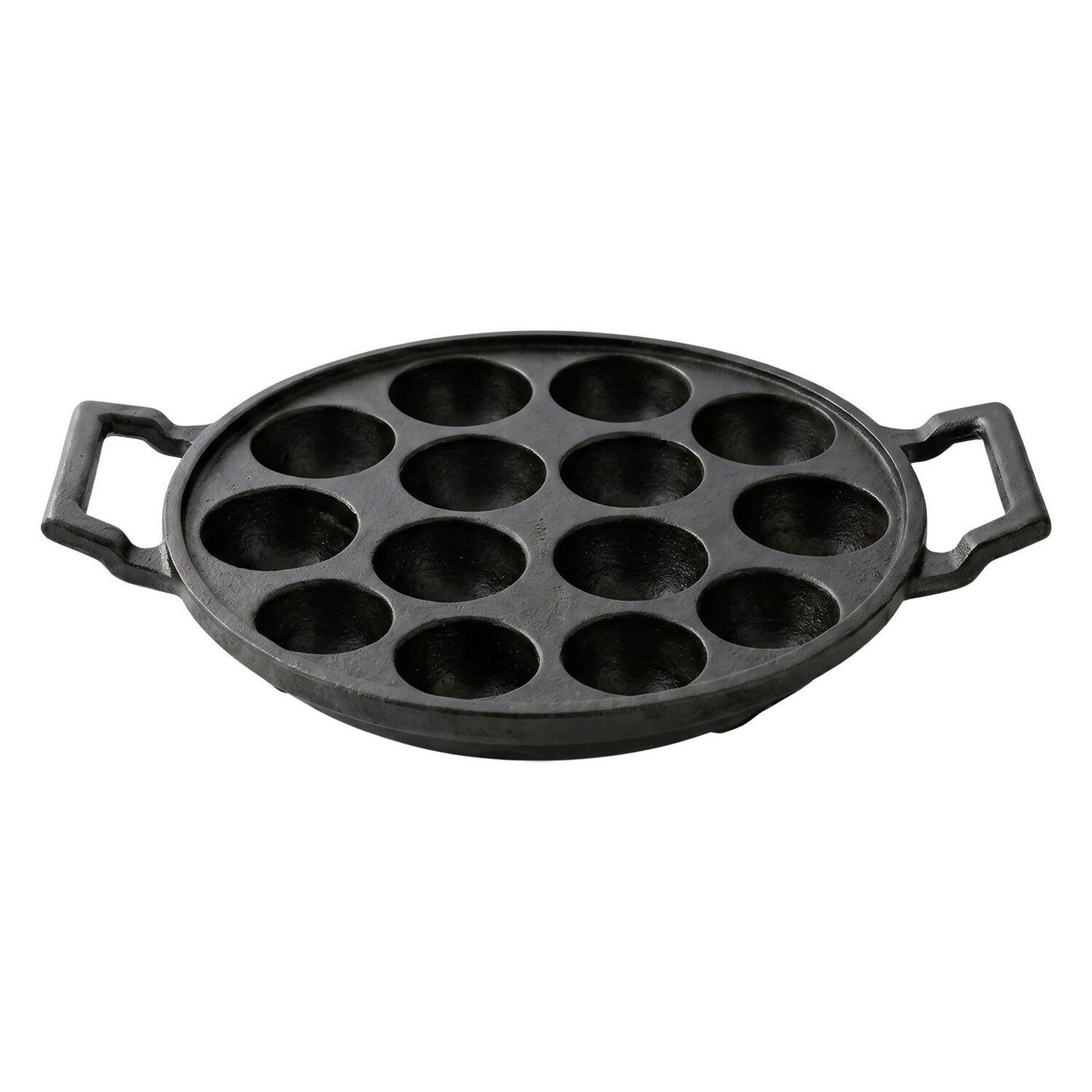 Cast iron pan with 12 cavities ready for cooking traditional snacks