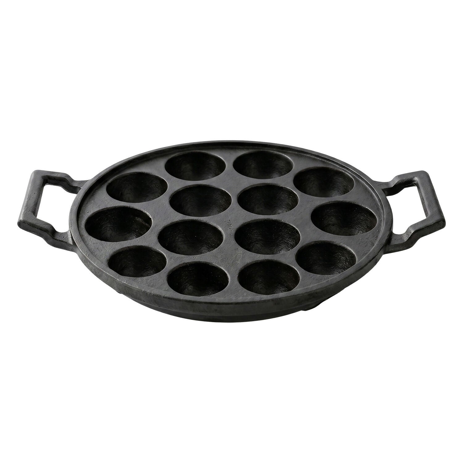 Cast iron pan with 12 cavities ready for cooking traditional snacks