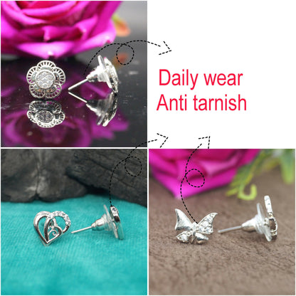 Silver butterfly zircon stud earrings sparkling under light