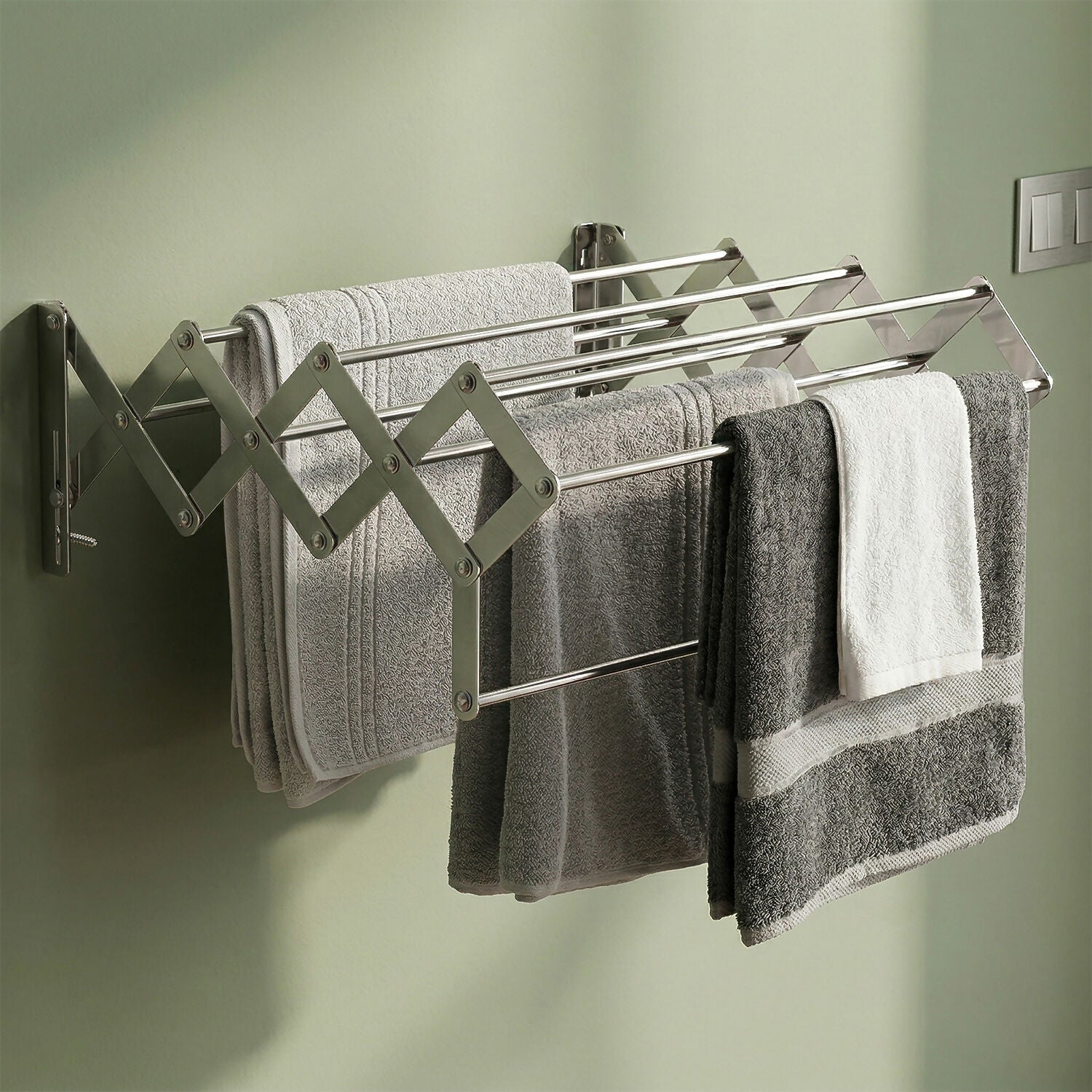 Close-up of stainless steel rods on foldable wall drying stand