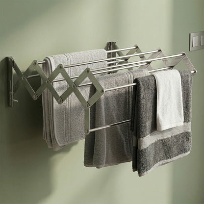 Close-up of stainless steel rods on foldable wall drying stand