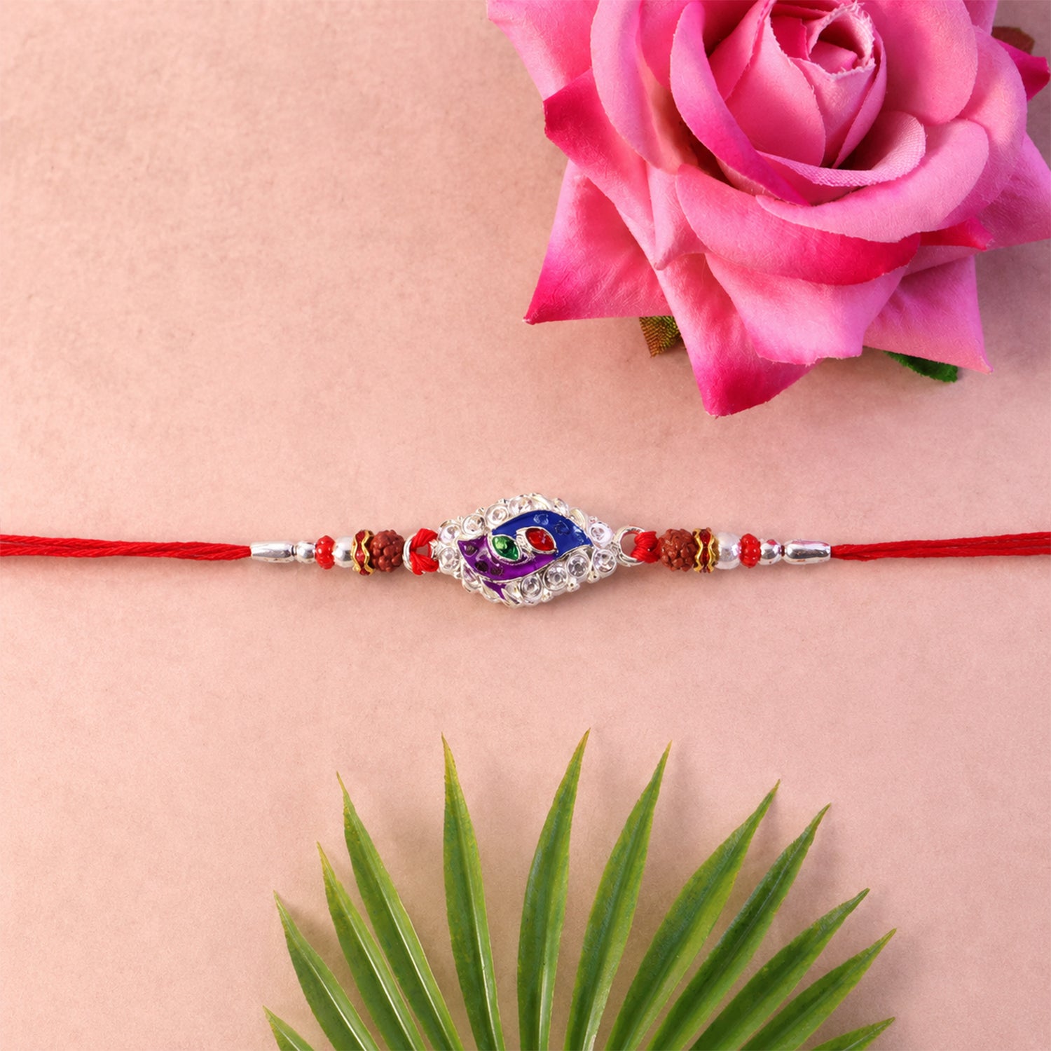 Morpich Enamel Rakhi with Silver Beads and Red Thread