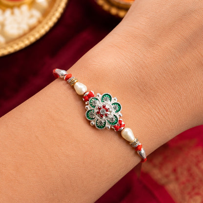 Green Flower Rakhi with Red Beads and Pearl Thread Styling