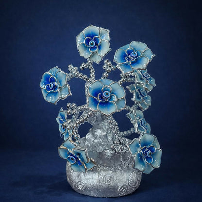 Decorative silver lucky tree statue with intricately crafted vase base and floral details