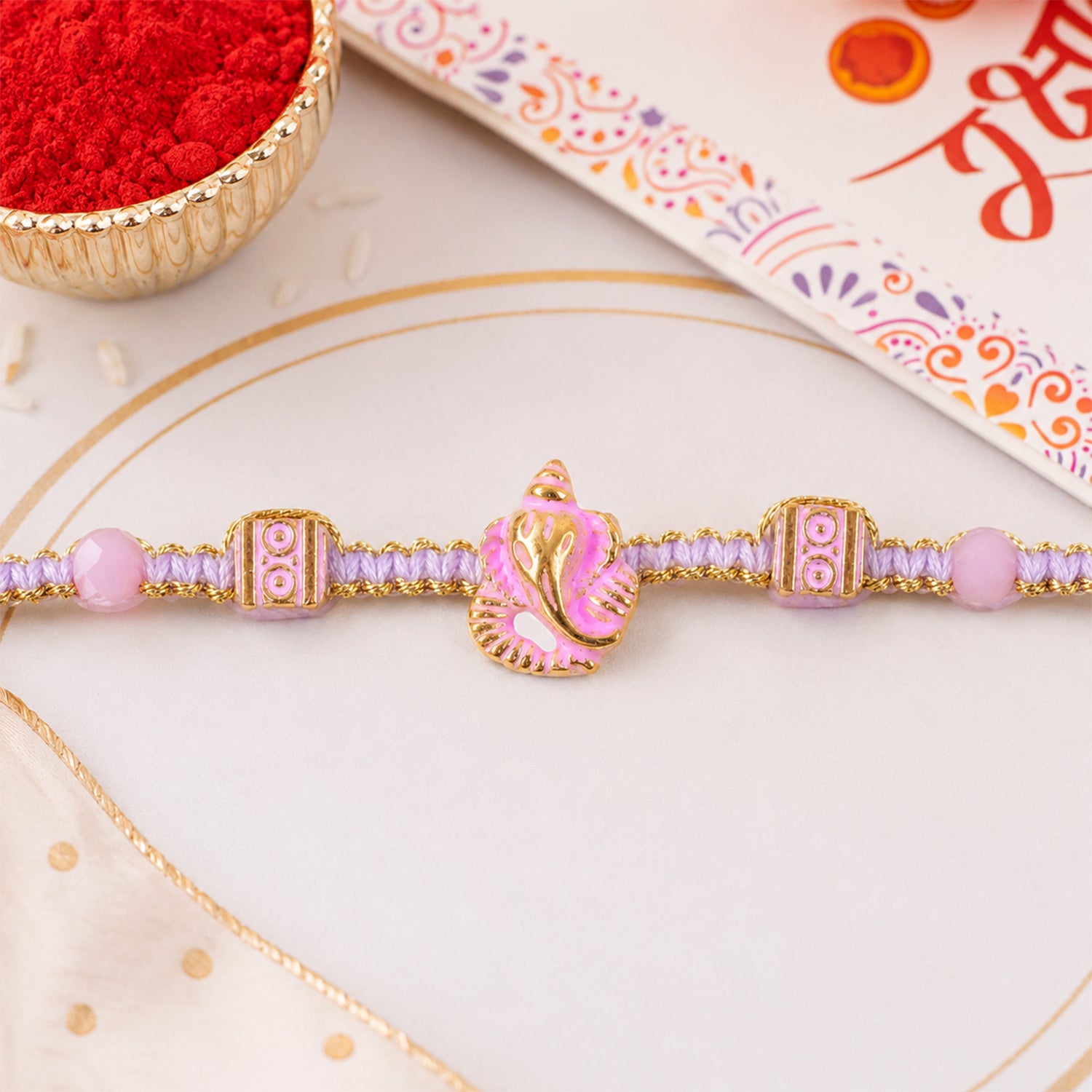 Pink Bracelet Designer Rakhi with Pearl Style Beads and Soft Festive Finish