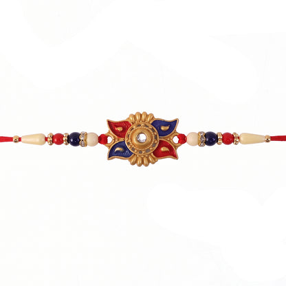 Gold Sunburst Rakhi with Blue Red Beads and Pearl Accents