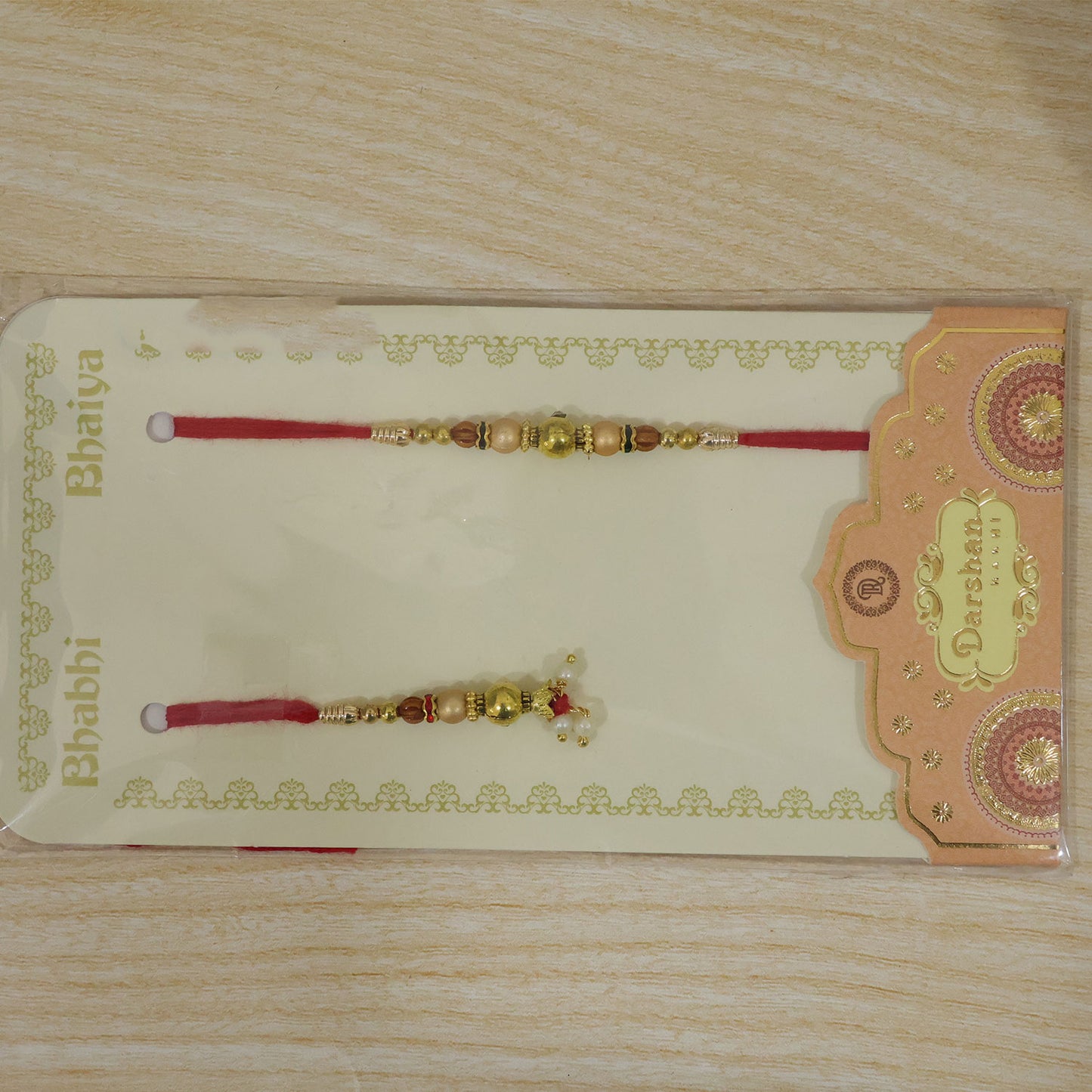 Ornamental Dangle Bhai Bhabhi Rakhi with Beaded Rakhi and Hanging Charm for Gifting