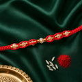 Red Braided Rakhi with Crystal Bead Pendant and Golden Accents