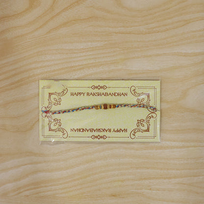 Graceful Pastel Pearl Rakhi with Fine Beads and Premium Raksha Bandhan Charm