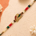 Bold Rakhi showcasing Devanagari Script Charm, bead line and plaque look for Gift Use