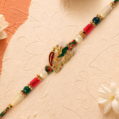 Bold Rakhi showcasing Devanagari Script Charm, bead line and plaque look for Gift Use