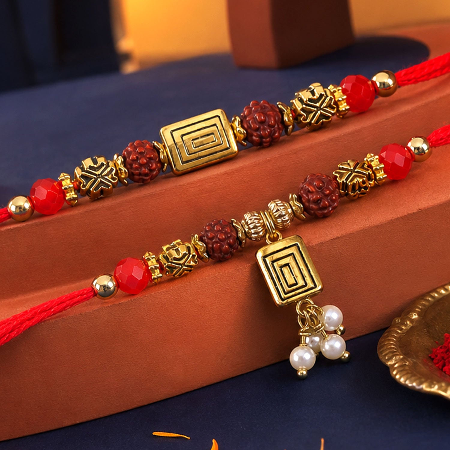 Rudraksha Geometric Rakhi Set with Pearl Lumba Charm for Festive Couple Gift Giving