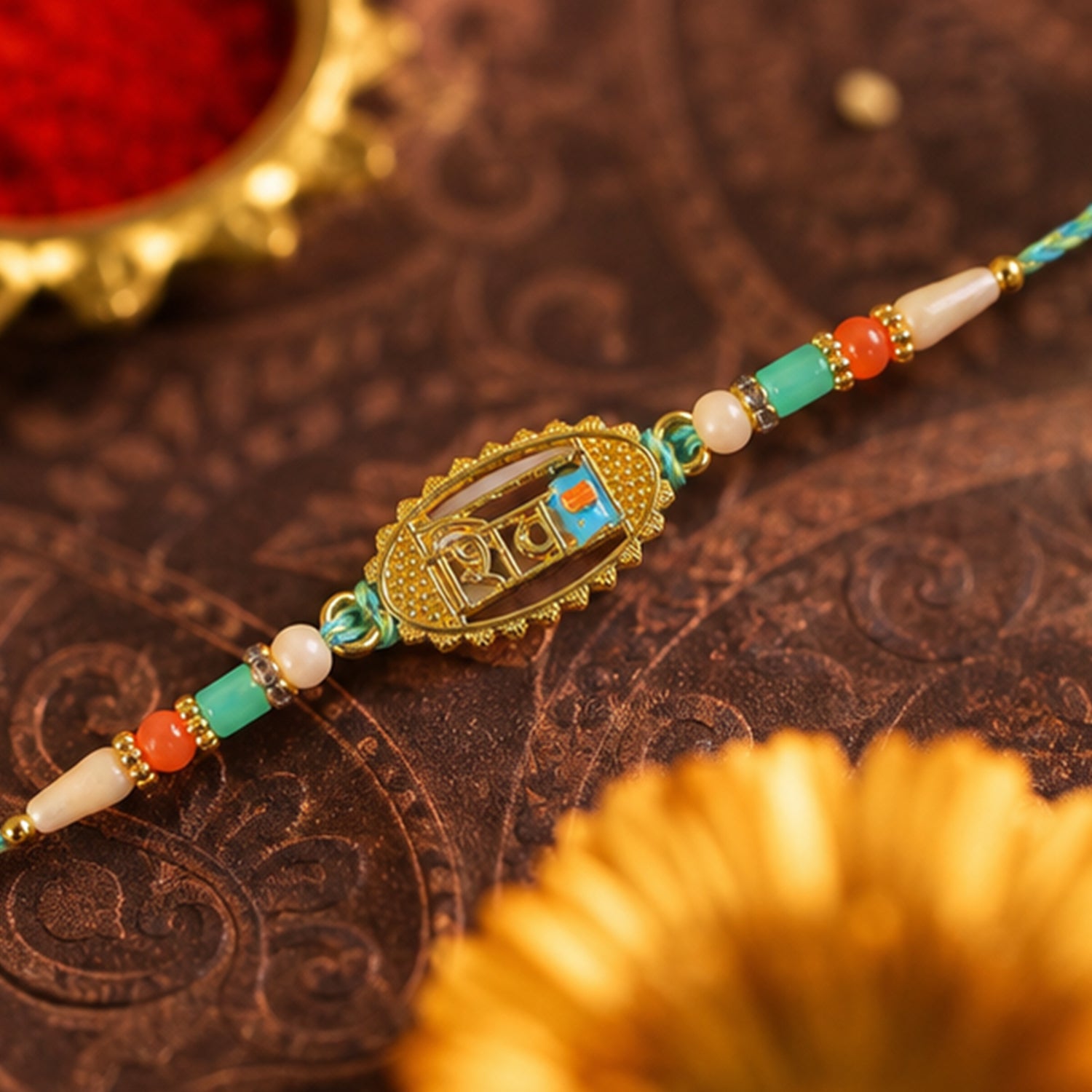 Shiv Script Pendant Rakhi with Teal and Orange Beads