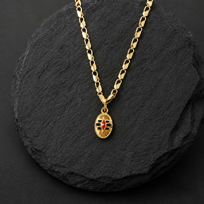 Necklace displaying gold-tone Shiva Tilak pendant and chain