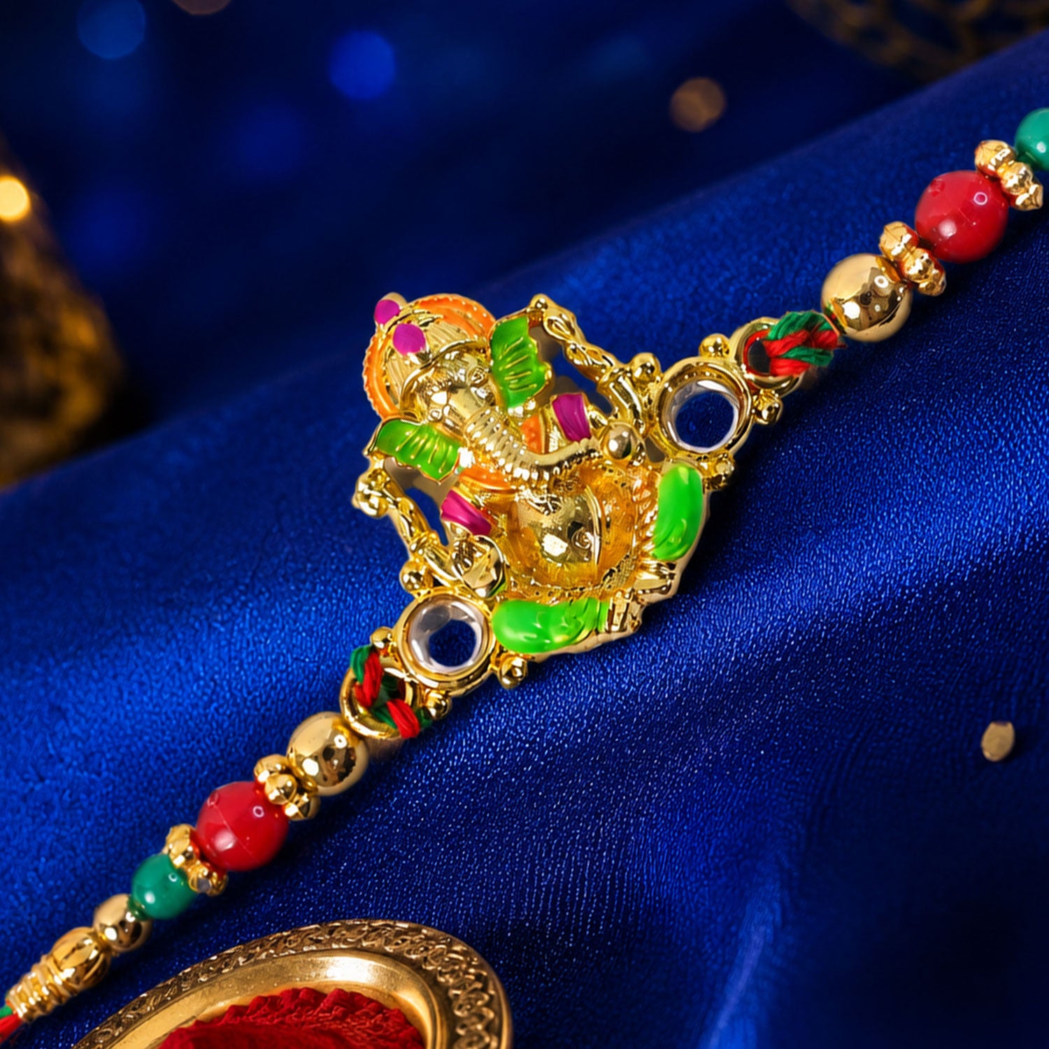 Colorful Ganesh Rakhi with Red Green Beads and Auspicious Festive Gifting Appeal
