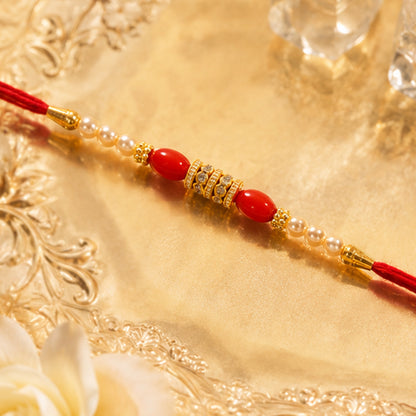 Red Moti Rakhi with Pearl Line and Antique Gold Spacer Beads