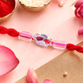Red Thread Rakhi with Pink and Clear Crystal Bead Pendant Accents