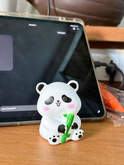 Panda silicone night lamp glowing in a softly lit room