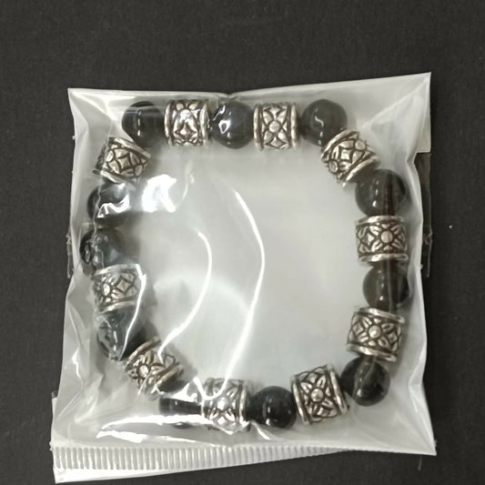 Antique finish oxidised beads bracelet on neutral background
