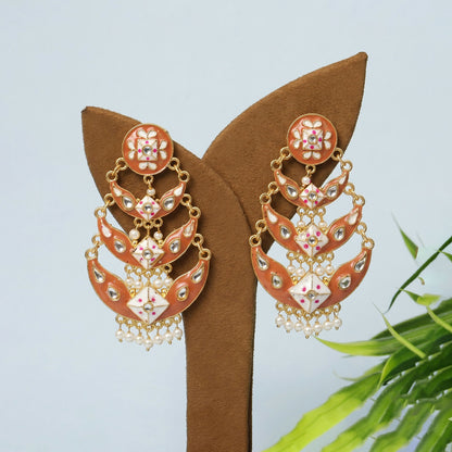 Decorative stones on peach gold meenakari drop earring detailing