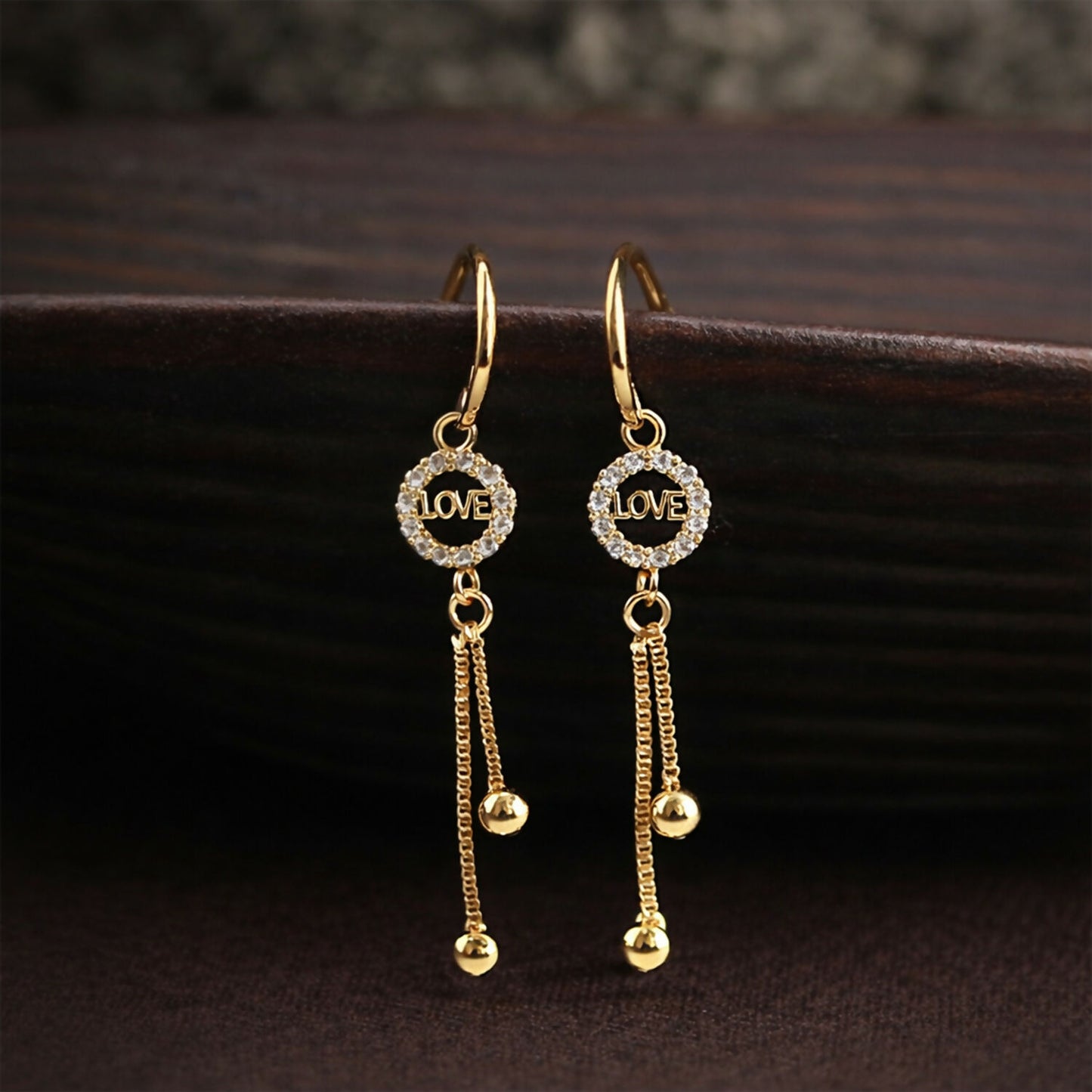 Pair of romantic Love Charm Tassel Earrings with delicate chain tassels and gold hoop top