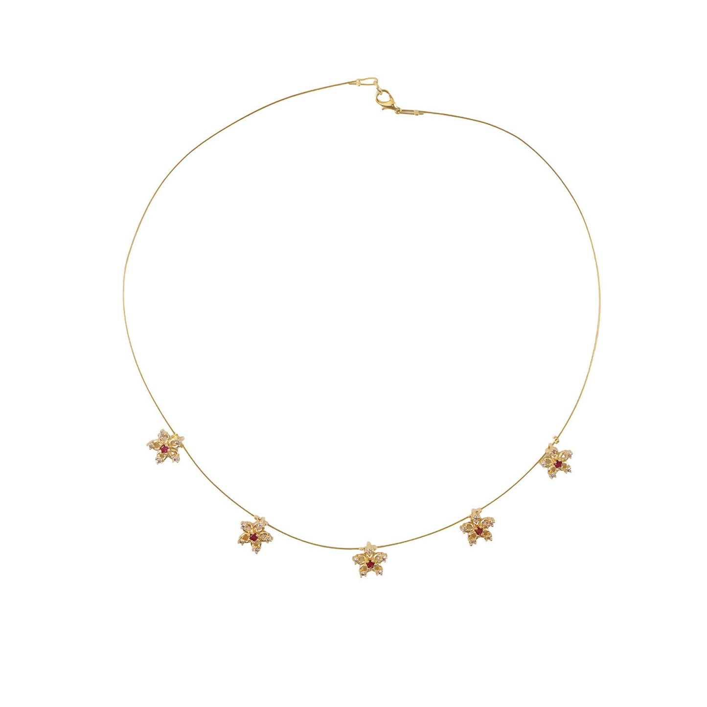 Detailed view of red & white stones on gold necklace flowers