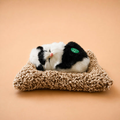 Side angle of sleeping cat plush toy dashboard decor