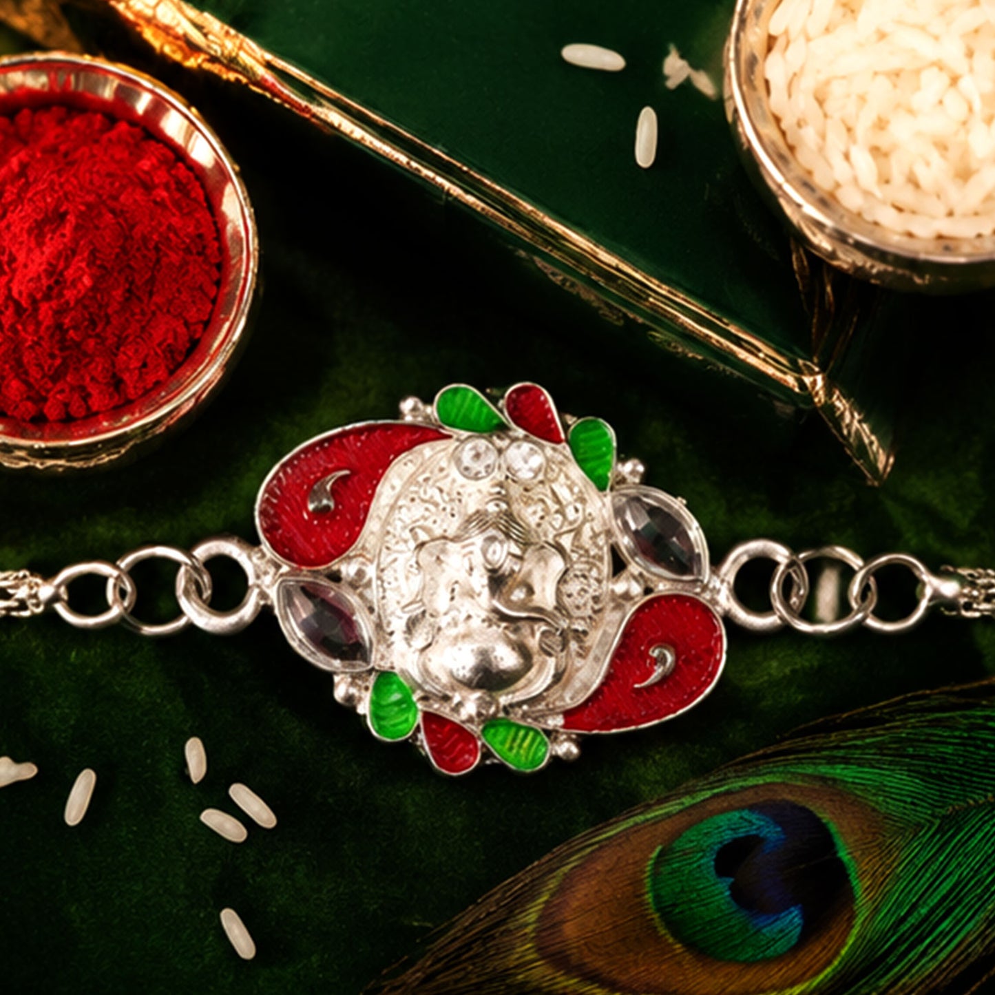 Detailed shot of the Ganesha motif on the Rakhi, showcasing its intricate craftsmanship and silver finish.