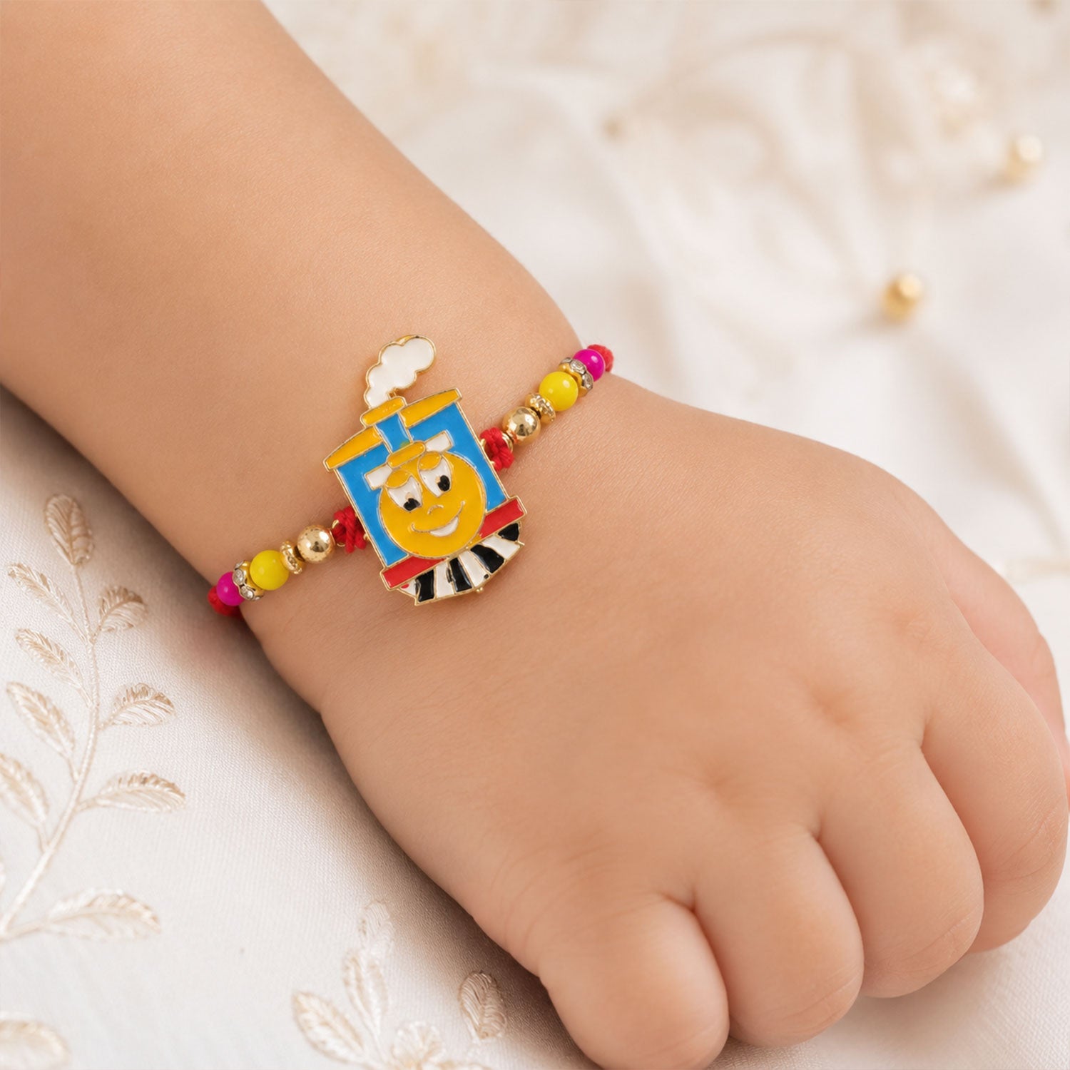 Train Cartoon Kids Rakhi – Colorful Beads & Red Thread Festive Gift