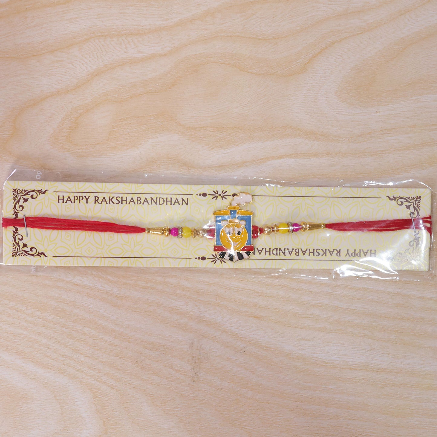 Train Cartoon Kids Rakhi – Colorful Beads & Red Thread Festive Gift