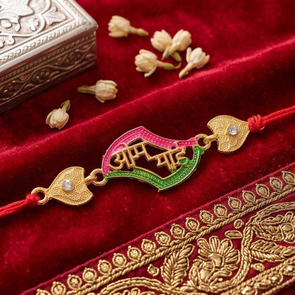 Side view of stone studded designer rakhi with intricate details.