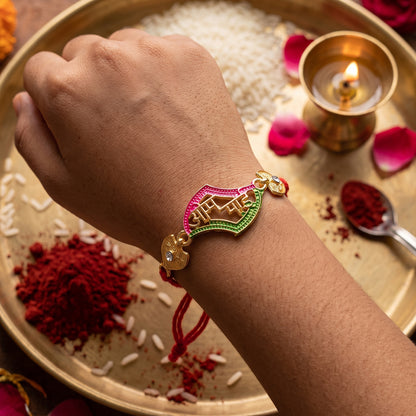 Om Saai text rakhi for brother displayed on a festive background.