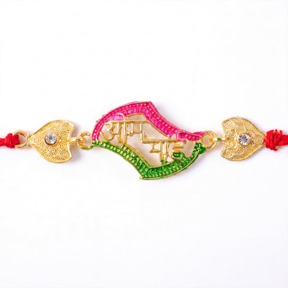 Hand holding the designer stone studded rakhi for Raksha Bandhan.