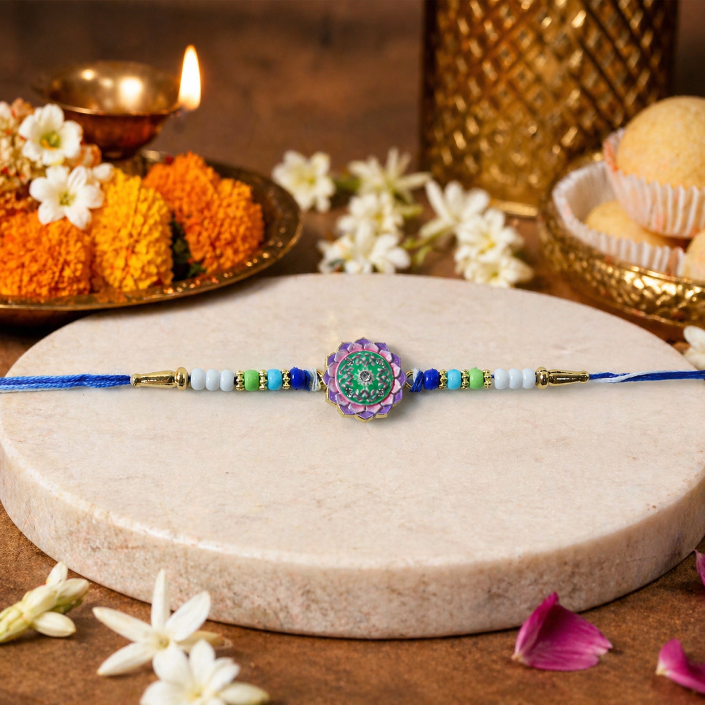 Close-up of Floral Stone Rakhi on Soft Thread