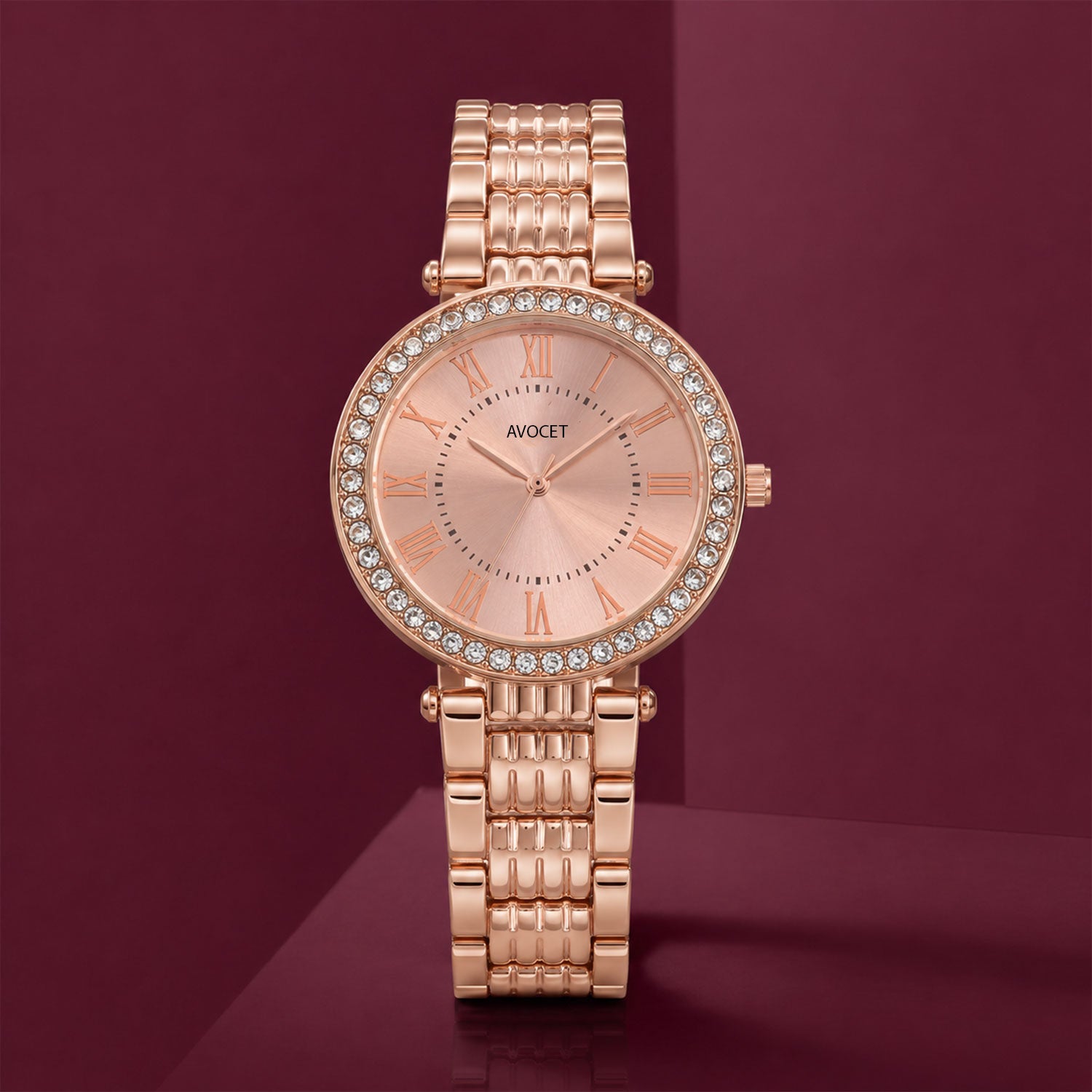 The women's rose gold watch presented on a decorative stand, emphasizing its luxurious appeal.